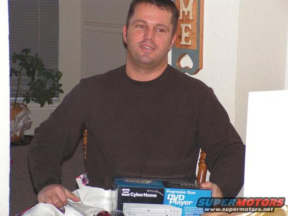 Man holding a CyberHome Progressive Scan DVD Player