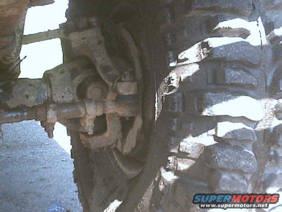 Close-up of front suspension and tire on a truck