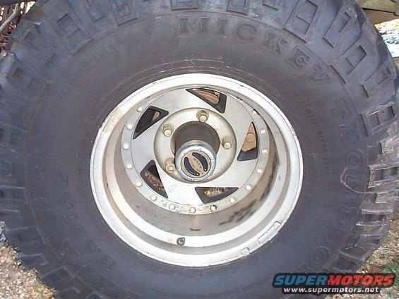 Close-up of a Mickey Thompson Baja radial tire on a Jeep wheel with a Warn hub