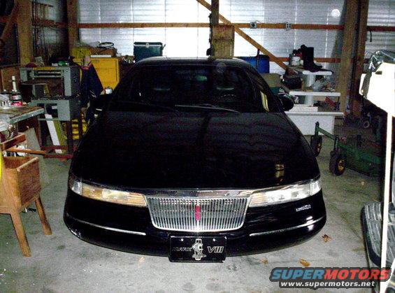 Black 1996 Lincoln Mark VIII parked in a garage, front view