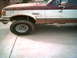 1988 Ford Bronco - This truck is covered in mud, suggesting it has been off-roading recently.
