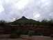 1990 Ford Bronco - A view of a mountain and surrounding arid landscape under a cloudy sky.