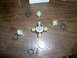 1978 Ford Bronco - Universal joint and associated parts are disassembled on a wooden table.