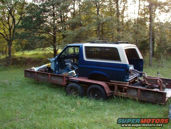 bodyntrailer.jpg SOLD Body tub, title, & camper shell.  Frame & trailer for sale as-is.  The loose parts inside are also for sale.