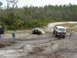 1993 Ford Bronco - Two SUVs are stuck in the mud during an off-road excursion.
