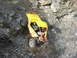1978 Ford Bronco - A heavily modified off-road vehicle navigates a steep, rocky terrain.