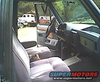 interior shot showing the custom bucket seats, and the center console