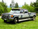 1988 Ford F-350 - left front view showing the grille guard and lights, bed tool box,air horns, boomerang TV antenna, and we can't forget that great grafix pa…