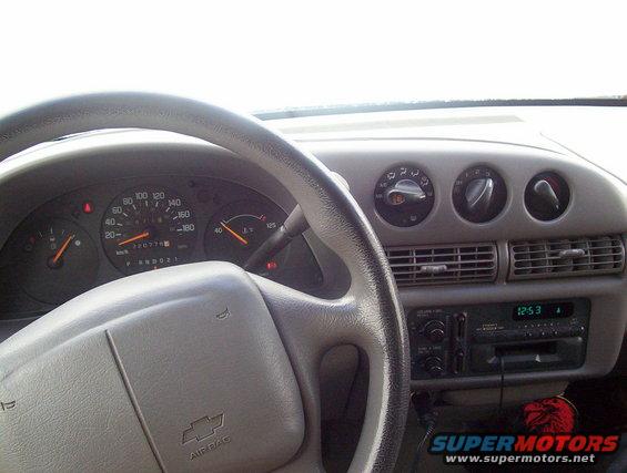 1995 Chevrolet Lumina interior dashboard with analog gauges and digital clock
