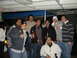 2000 Ford F-450 - Several men are gathered together, appearing to be at a casual outdoor event or party.