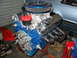 1985 Ford Crown Victoria LTD - A rebuilt V8 engine sits on a stand, ready for installation into a vehicle.