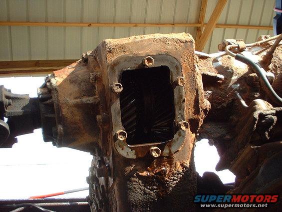 rusty truck transmission with gears visible through an opening