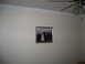 2002 Ford Taurus - A framed wedding photograph hangs on a textured wall, with a ceiling fan visible above.