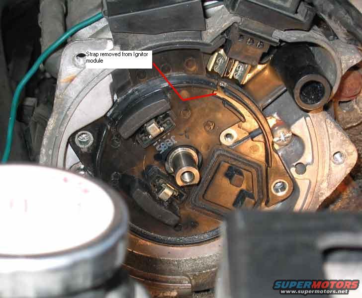Distributor cap interior with text 'Strap removed from Ignitor module' and part number '3885'