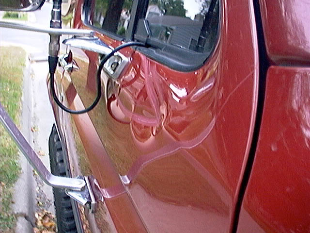 dent1.jpg Kind of ran into a tree branch and got it lodged in the mirror.