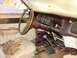 1969 Mercury Cougar - The interior of this abandoned vehicle is filled with debris and shows significant wear and tear.
