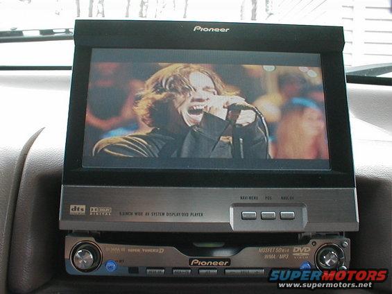Pioneer car stereo system with a screen displaying a singer performing