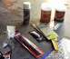 1985 Ford Crown Victoria LTD - Various automotive body repair products are gathered, including Bondo body filler and Dupli-Color spray paint.