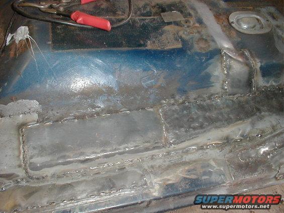 Welded floor pan with blue undercoating
