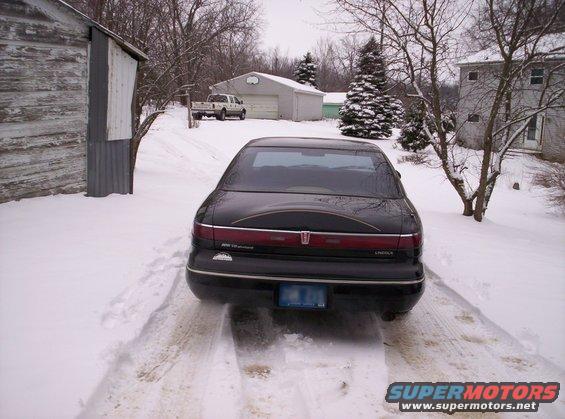 1996 Lincoln Mark VIII rear view in snowy driveway