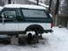 1994 Ford Bronco - This 1994 Ford Bronco is elevated on blocks and jack stands with its rear axle removed, sitting in a snowy yard.