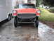 1978 Ford Bronco - A classic 1955 Chevrolet Bel Air is shown from the front, modified with a custom suspension and grille.