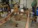 1978 Ford F-350 - The chassis of a 1978 Ford F-350 is disassembled and supported by jack stands in a workshop.