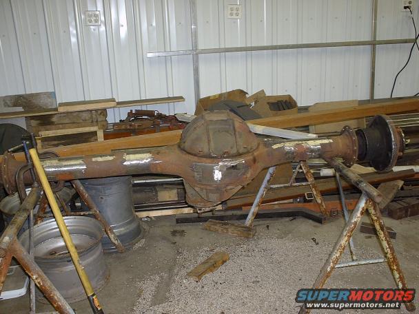 Rear axle assembly on stands, showing differential housing and axle tubes