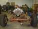 1978 Ford F-350 - A vehicle's chassis and engine are assembled in a workshop, surrounded by tools and equipment.