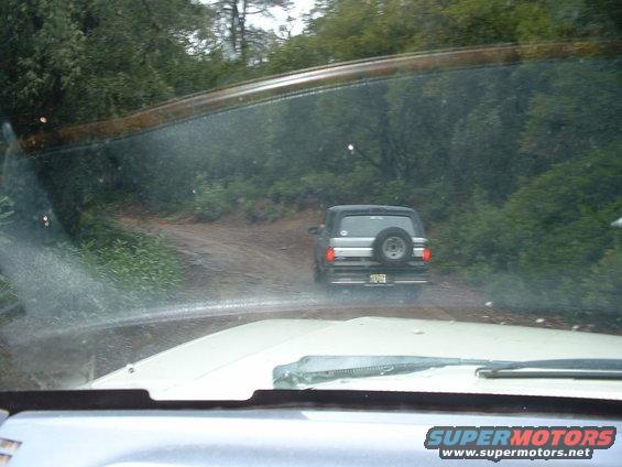 Driving behind a 1991 Ford Bronco on a dirt road