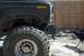 1986 Ford Bronco - This black Ford Bronco appears to be undergoing modifications, with its front end partially disassembled.