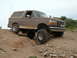 1993 Ford Bronco - This 1993 Ford Bronco is shown navigating a challenging off-road terrain.