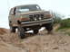 1993 Ford Bronco - This 1992 Ford Bronco navigates a rocky, off-road trail with its front passenger wheel elevated.