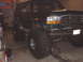 1996 Ford Bronco - This modified 1996 Ford Bronco features a significant lift and massive off-road tires, giving it an aggressive stance.