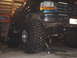 1996 Ford Bronco - This 1996 Ford Bronco is shown with massive off-road tires and is supported by a jack.