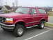 1994 Ford Bronco - This 1994 Ford Bronco is shown in a parking lot with a mountainous background.