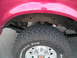 1994 Ford Bronco - Close-up of the rear wheel and suspension system on a 1994 Ford Bronco.