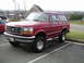 1994 Ford Bronco - This lifted 1994 Ford Bronco is shown in a three-quarter front view, parked in a lot.