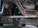 1994 Ford Bronco - Close-up of the vehicle's undercarriage, focusing on suspension and frame components.