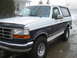 1992 Ford Bronco - This 1992 Ford Bronco features a two-tone paint scheme with white and dark blue sections.