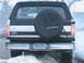 1992 Ford Bronco - The rear of a 1992 Ford Bronco is visible, with a spare tire cover and 'For Sale' sign in the window.