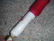 1994 Ford Bronco - A white shock absorber with a red boot and red lettering is shown against a carpeted background.