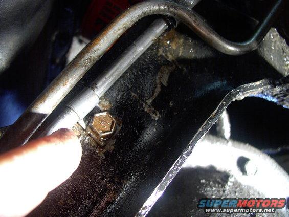 img_0009.jpg Slacking off this half inch cooler pipe retaining clamp bolt helps get the hoses off and on. Just remember to re-tighten it later.