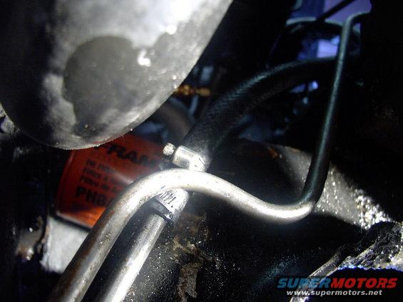 img_0070.jpg Now that the flushing is done I removed the clear hose and installed the new PS hose with two opposed hose clamps as seen here.