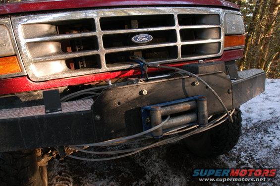 Red 1995 Ford Bronco front grille with winch