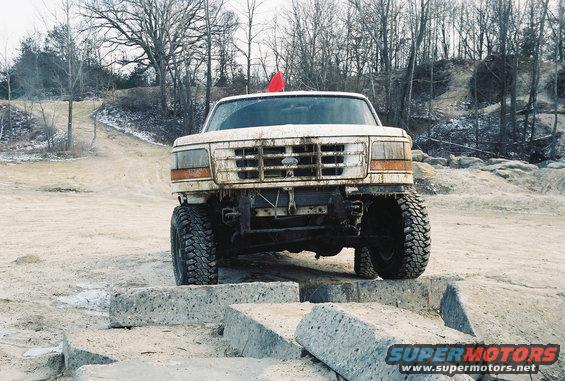 White 1995 Ford Bronco front view on concrete blocks