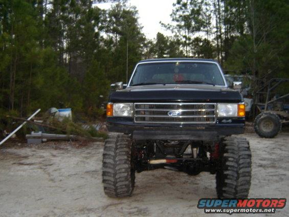 1989 Ford Bronco front view with large tires and lifted suspension