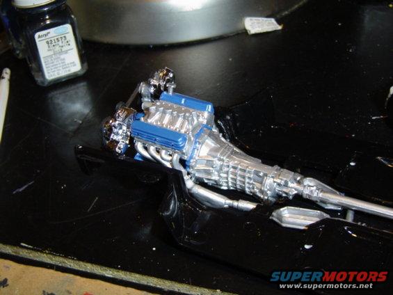 Model engine and transmission assembly with blue valve covers and chrome details