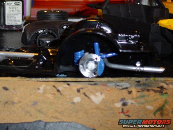 model car chassis with suspension and exhaust detail