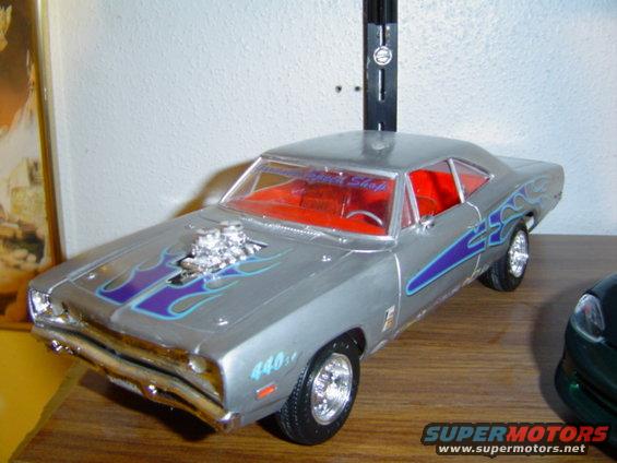 Silver model car with purple flames and a blower scoop, red interior, and '440' badging